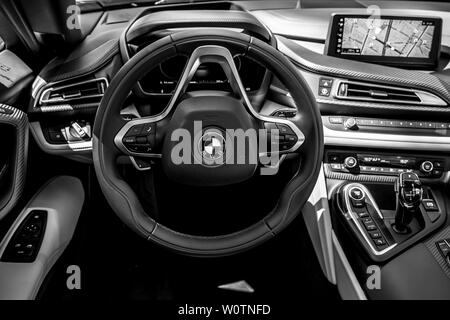 BERLIN - JUNE 09, 2018: Showroom. Interior of a plug-in hybrid sports car BMW i8 Roadster. Black and white. Stock Photo