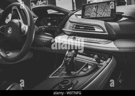 BERLIN - JUNE 09, 2018: Showroom. Interior of a plug-in hybrid sports car BMW i8 Roadster. Black and white. Stylization. Stock Photo
