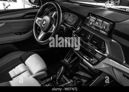 BERLIN - JUNE 09, 2018: Showroom. Interior of compact luxury crossover SUV BMW X3. Black and white. Stock Photo
