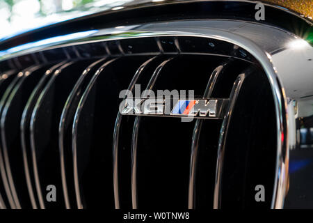 BERLIN - JUNE 09, 2018: Showroom. Fragment of a mid-size luxury crossover SUV BMW X6 M. Stock Photo