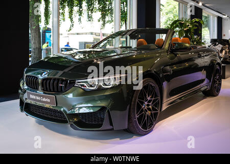 BERLIN - JUNE 09, 2018: Showroom. Compact executive car/Sports car BMW M4 Cabrio. Stock Photo
