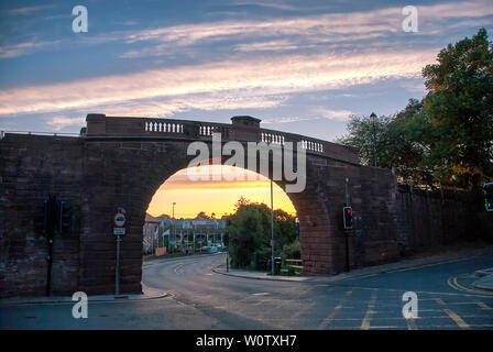 Sunset behind the Watergate arch bridge in Chester, UK Stock Photo