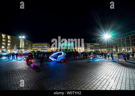 BERLIN - OCTOBER 07, 2018: Pariser Platz and Brandenburg Gate in brightly colored illuminations. Festival of lights 2018. Stock Photo