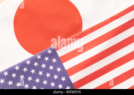 Concept of Bilateral relationship between two countries showing with two flags: The United States of America and Japan. Stock Photo
