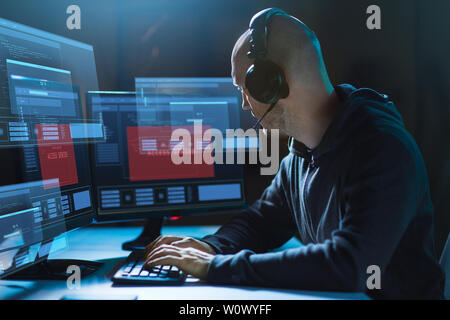 hacker with access denied messages on computers Stock Photo
