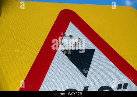 Rural crime, road signs shot and damaged by criminals/vandals. Rural crime / Gun crime escalation in England. Oxfordshire countryside, Bicester UK. Stock Photo