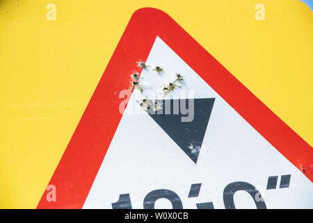 Rural crime, road signs shot and damaged by criminals/vandals. Rural crime / Gun crime escalation in England. Oxfordshire countryside, Bicester UK. Stock Photo