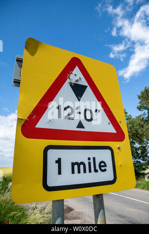 Rural crime, road signs shot and damaged by criminals/vandals. Rural crime / Gun crime escalation in England. Oxfordshire countryside, Bicester UK. Stock Photo