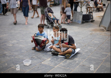 Child beggars on the streets of Chania in Crete Greece Stock Photo