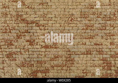 A large cream, red and orange painted brick wall, repeated pattern ideal for background or textured backdrop Stock Photo