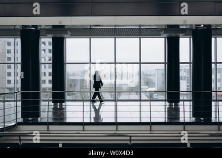 Serious elder man in big office centre Stock Photo