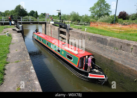 Diglis, Worcester, UK -  June 2019 - A canal boat passes through the locks at Diglis Basin in Worcester on a hot sunny day. The Worcester & Birmingham Canal joins the River Severn at Worcester. Photo Steven May / Alamy Live News Stock Photo