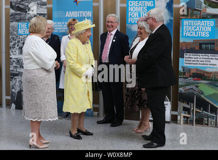 Queen Elizabeth II chats with locals during a visit to Greenfaulds High School in the west of Cumbernauld. Stock Photo