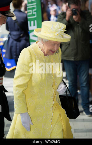 Cumbernauld, UK. 28 June 2019.  PICTURED: Her Majesty The Queen. On arrival at Greenfaulds High School, Her Majesty is met by the Lord Lieutenant of Dunbartonshire and the Lord Lieutenant of Lanarkshire before moving to the central atrium where a Gaelic welcome by senior pupils from the school. The Queen will be invited to view an exhibition and the headteacher, together with local historians, will explain the school’s history.  Credit: Colin Fisher/Alamy Live News Stock Photo