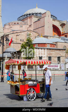 Istanbul, Istanbul Province / Turkey: 17 April, 2016: street vendors in Istanbul selling the typical and famous corn on the cob from their wagon stall Stock Photo