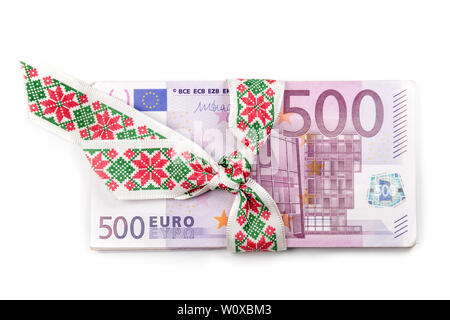 Stack of Euro banknotes with ribbon. 500 Euro banknotes. European currency money banknotes isolated on white backdrop. Top view closeup. Stock Photo