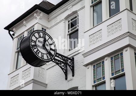 The ornate Northern Goldsmiths clock  on a hanging bracket on the jewellers shop in Goldsmiths,Darlington,England,UK Stock Photo