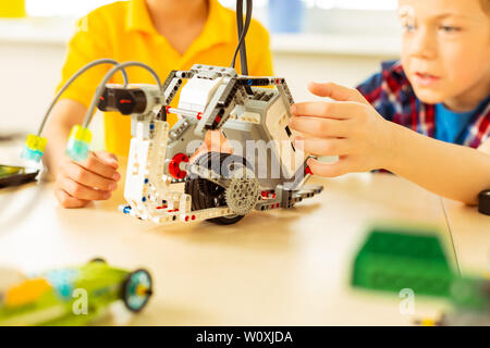 Robotics class. Close up of a modern robot being constructed during the robotics class Stock Photo