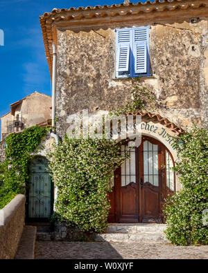 Jasmine framed arched doorway in medieval village of Eze, Provence, France Stock Photo