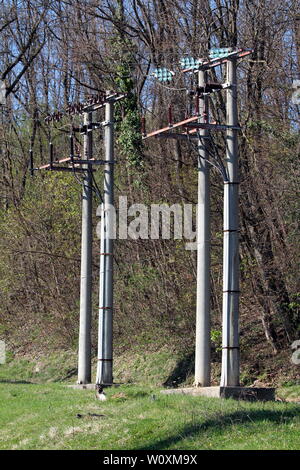 Concrete electrical power line utility pole with ceramic insulators and ...