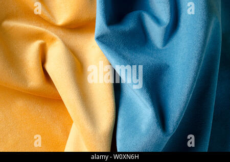 Yellow and blue soft velour fabric, textile samples. Colors of ukrainian flag. Fabric texture background. Stock Photo