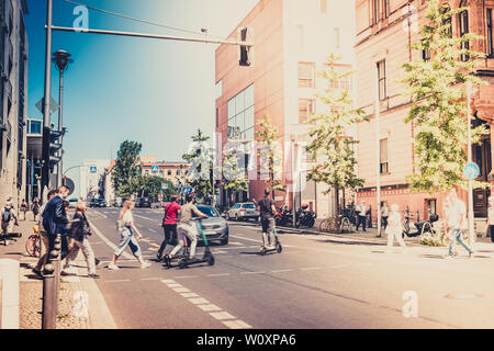 unrecognizable people crossing road at traffic light  - City traffic concept Stock Photo