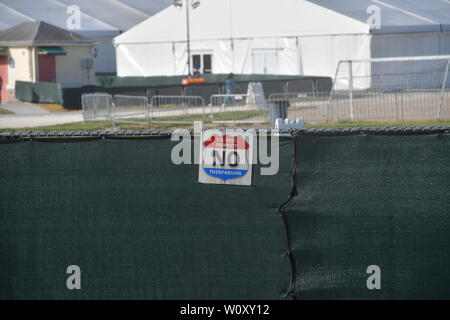 HOMESTEAD, FLORIDA - JUNE 27: Atmosphere of facility holding migrant children in front of a detention center. The controversial for-profit detention center holds around 2,300 children from the ages of 13 to 17, who have been placed in the care of the Department of Health and Human Services after being detained at the border on June 27, 2019.on June 26, 2019 in Homestead Florida   People:  Atmosphere Stock Photo