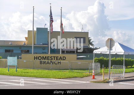 HOMESTEAD, FLORIDA - JUNE 27: Atmosphere of facility holding migrant children in front of a detention center. The controversial for-profit detention center holds around 2,300 children from the ages of 13 to 17, who have been placed in the care of the Department of Health and Human Services after being detained at the border on June 27, 2019.on June 26, 2019 in Homestead Florida   People:  Atmosphere Stock Photo