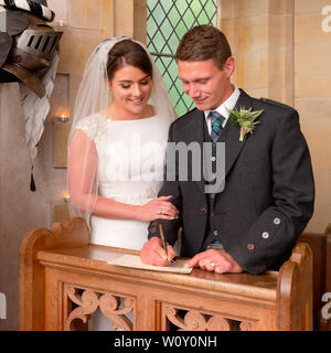 A bride and groom from a Scottish wedding which took place on the Belladrum Estate, Kiltarlity, Inverness-shire. Stock Photo