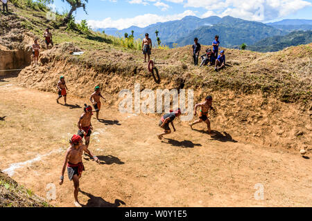 San Andres Semetabaj, Lake Atitlan, Guatemala - November 10, 2018:  Local indigenous Maya men play Maya ballgame in a newly dug ballgame court. Stock Photo