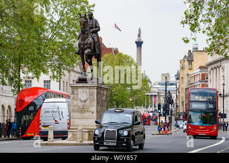 British taxi and bus on Parliament St in London, United Kingdom