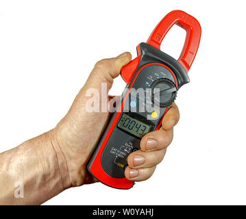 A device for measuring voltage, current, resistance in the hand on a white background.  isolated.  clamp multimeter. Stock Photo