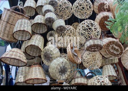 wicker straw baskets and lampshades on sale outside athens shop in greece Stock Photo