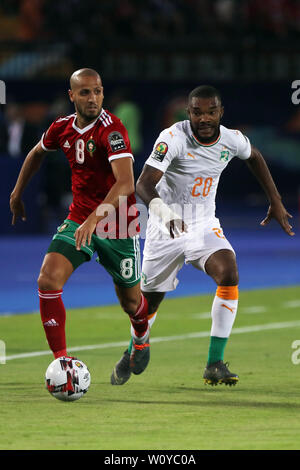 Cairo, Egypt. 28th June, 2019. Morocco's Karim El Ahmadi (L) and Ivory coast's Serey Die battle for the ball during the 2019 Africa Cup of Nations Group D soccer match between Morocco and Ivory coast at Al-Salam Stadium. Credit: Omar Zoheiry/dpa/Alamy Live News Stock Photo