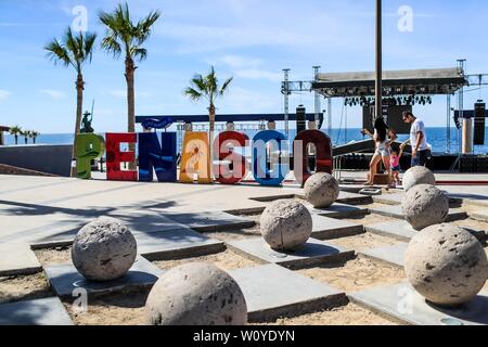 Letters of various colors with the word Penasco in the tourist destination called Puerto Penasco, Sonora, Mexico. laza or malecon of the tourist desti Stock Photo