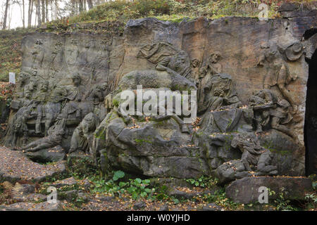 Two abandoned relieves 'Adoration of the Magi' and 'Nativity of Jesus' (R) in the area of the open air sculptural gallery known as the Braunův Betlém (Braun's Bethlehem) in the forest near the village of Žireč in East Bohemia, Czech Republic. The monumental relieves were carved by famous Austrian-born sculptor Matthias Bernhard Braun (Matyáš Bernard Braun) from 1726 to 1734 among other statues and relieves directly in sandstone rocks in the New Forest near the Kuks Hospital (Nový les u Kuksu). The Braunův Betlém is considered to be one of the masterpieces of Bohemian Baroque sculpture. Stock Photo