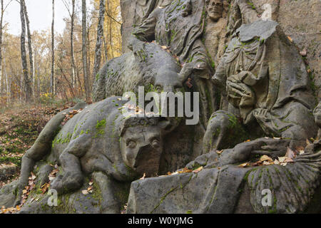 Cow and donkey depicted in the detail of the abandoned relief 'Nativity of Jesus' in the area of the open air sculptural gallery known as the Braunův Betlém (Braun's Bethlehem) in the forest near the village of Žireč in East Bohemia, Czech Republic. The monumental relief was carved by famous Austrian-born sculptor Matthias Bernhard Braun (Matyáš Bernard Braun) from 1726 to 1734 among other statues and relieves directly in sandstone rocks in the New Forest near the Kuks Hospital (Nový les u Kuksu). The Braunův Betlém is considered to be one of the masterpieces of Bohemian Baroque sculpture. Stock Photo