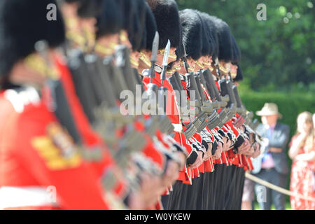 Edinburgh, UK. 28 June 2019.  Her Majesty The Queen attends the Ceremony Of The Keys at the Palace Of Holyroodhouse in Edinburgh.  The Guard of Honour will is F Coy Scots Guards.  Pipes and Drums are provided by the 1st Battalion, Scots Guards and Music by the Band of The Royal Regiment of Scotland. Credit: Colin Fisher/Alamy Live News Stock Photo