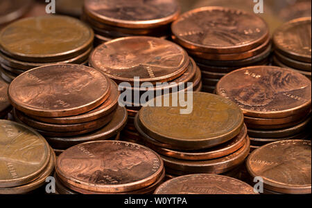 stacked coins, pennies, lined up in rows Stock Photo