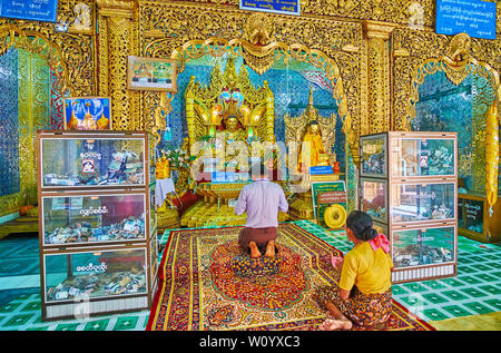 POPA, MYANMAR - FEBRUARY 26, 2018:  The Image House of Popa Taung Kalat monastery with ornate decorations - gilt wooden carvings, fine mirror patterns Stock Photo