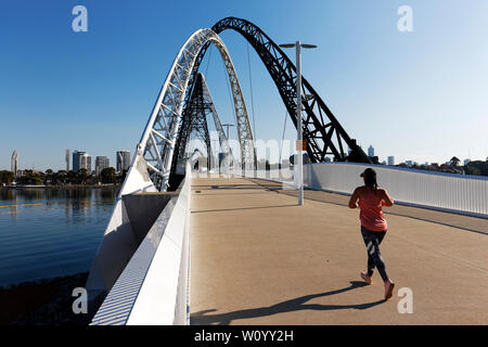 Woman running on Matagarup Bridge , Perth, Western Australia Stock Photo