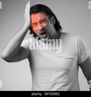 Man suffering from acute headache Stock Photo