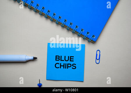 Blue Chips text on sticky notes with office desk concept Stock Photo