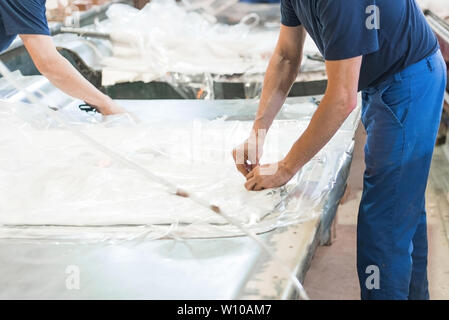 factory worker working with polyethylene Stock Photo