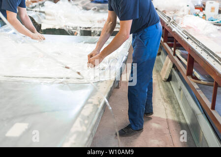 factory worker working with polyethylene Stock Photo
