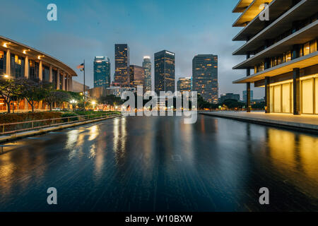 The downtown Los Angeles skyline at night, with the reflecting pool at the Department of Water and Power, in Los Angeles, California Stock Photo