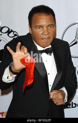 Muhammad Ali demonstrates a magic trick at The 16th Annual Carousel of ...