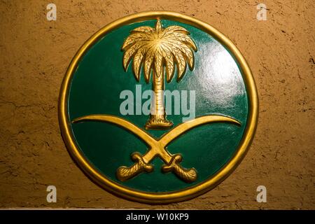 Saudi flag, sign with palm and daggers, Masmak Fort, Riad, Saudi Arabia Stock Photo