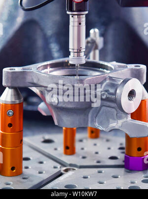 Close up automatic coordinate measurement machine (CMM) for inspection high precision part during working Stock Photo