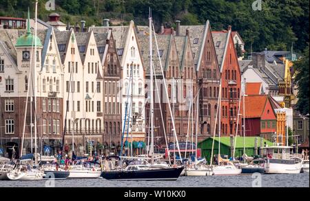 Sailing ships in front of row of houses, historical Hanseatic quarter Bryggen, Bergen, Hordaland, Norway Stock Photo